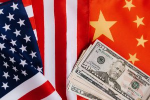 american-and-chinese-flags-and-usa-dollars-4386371